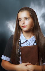 portrait of teenage girl with book