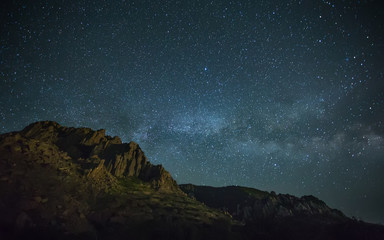 Fototapeta na wymiar night photo of the mountains, Milky Way over the sea, the starry sky