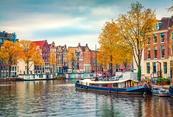 Foto op Aluminium Splendid autumn scene of Amsterdam city. Famous Dutch channels and great cityscape. Colorful morning landscape in Netherlands, Europe. Traveling concept background.. © Andrew Mayovskyy