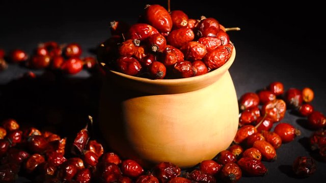 Detail macro view of dog rose hips in bowl latin name Fructus cynosbati . Dried rose hips are important source of vitamins in alternative medicine.