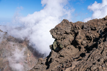 Fototapeta na wymiar Above the clouds, volcanic landscape at Roque de los Muchachos, the highest point on La Palma Island, Canaries