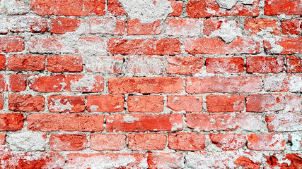 Rough red brick wall background texture.