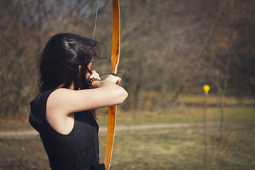 Warrior medieval woman with bow in battlefield