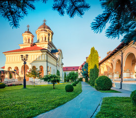 Fototapeta na wymiar Superb morning view of Reunification Cathedral, Fortified churches inside Alba Carolina Fortress. Stunning summer scene of Transylvania, Alba Iulia city, Romania, Europe.