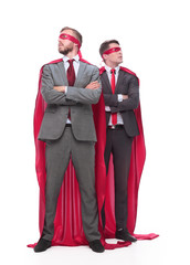 two business men superheroes standing together. isolated on white