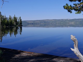 Tranquility over the waters of Yellowstone Lake at Yellowstone National Park, Wyoming, USA.