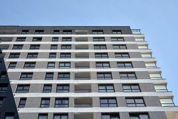 Detail of modern residential flat apartment building exterior. Fragment of new luxury house and home complex.