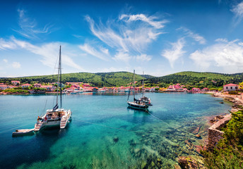 Picturesque morning view of Fiskardo port. Amazing summer seascape of Ionian Sea. Colorful scene of Kefalonia island, Greece, Europe. Traveling concept background.