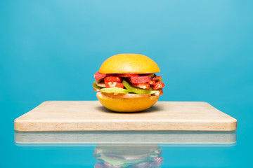 sandwich without bread and meat lies on a wooden board