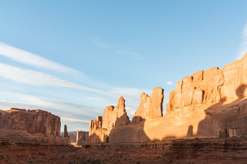 Park Avenue in Arches National Park. A wall made by rock formations with shadows and sunset lights