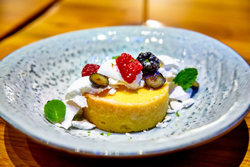 Lemon tart with berries is on the plate