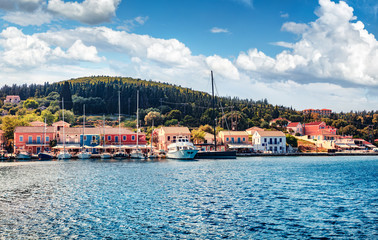 Amazing summer view of port Fiskardo. Captivating morning seascape of Ionian Sea. Stunning outdoor scene of Kefalonia island, Greece, Europe. Traveling concept background.