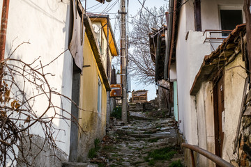 Fototapeta na wymiar Veliko Tarnovo city, Bulgaria - March 24, 2017. Traditional Bulgarian architecture in the old medieval town area, Veliko Tarnovo city, Bulgaria