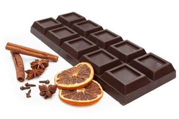 dark chocolate, dried orange, anise, cinnamon, cloves - composition. isolated on white background.
