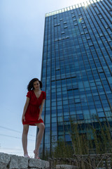 young woman in front of office building