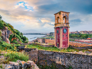 Splendid summer view of Old Venetian Fortress (Paleo Enetiko Frourio) with Clock Tower. Colorful...