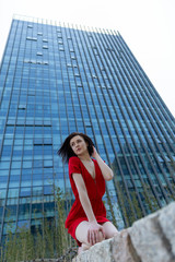 young woman in front of office building