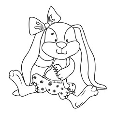 Soft toy rabbit sits and smiles