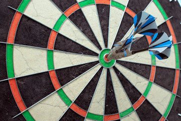 Three darts in the target center