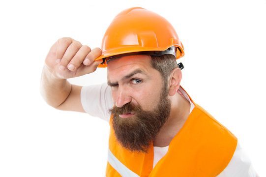 Brutal and hardworking. Brutal worker isolated on white. Bearded man with brutal look. Construction worker or builder wear safety hat and vest. Brutal work
