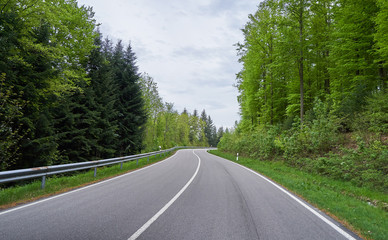Fototapeta premium Beautiful asphalt road with turns through the Schwarzwald forest in Germany