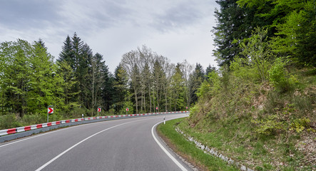 Beautiful asphalt road with turns through the Schwarzwald forest in Germany