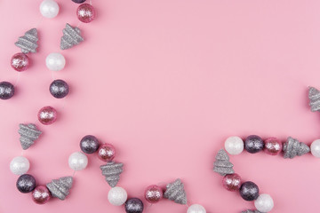 Christmas garland on a pink background. Flat lay, top view