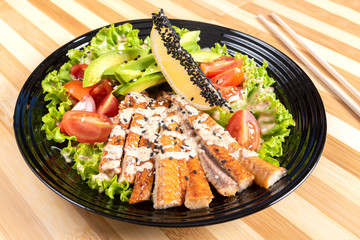 Salmon grilled salad, with herbs and lemon.
