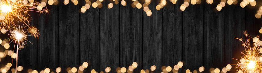 Silvester New Year 2025, New Year's Eve background banner panorama long- sparklers and bokeh lights...