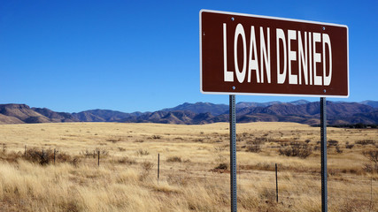 Loan denied brown road sign