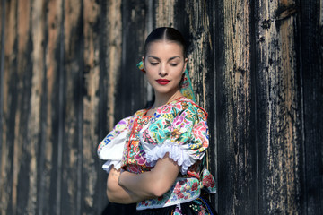Fototapeta premium Beautiful woman wearing traditional slovak folk costumes. .