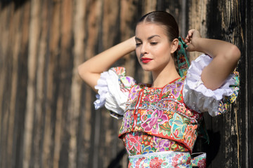 Beautiful woman wearing traditional slovak folk costumes. .