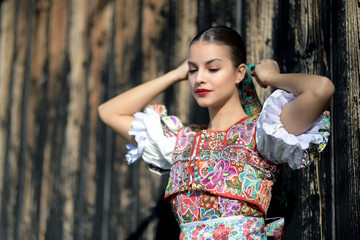 Beautiful woman wearing traditional slovak folk costumes. .