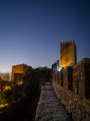 Sunset view of the old town walls, decorated for Christmas, in Obidos, Portugal