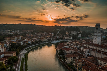 Aerial drone shot view of Adige river bank at foot of Veronetta colline and castel San Pietro