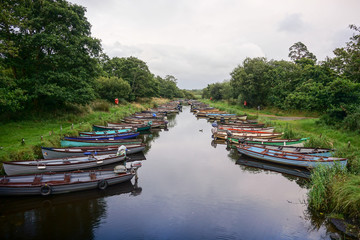 Fototapeta na wymiar Boat on the River Stream - Ireland