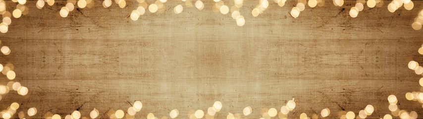 Festive background panorama banner long - Bright bokeh lights on rustic wooden texture, top view...
