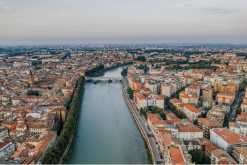 Aerial overhead drone shot view of verona city with adige river during sunrise