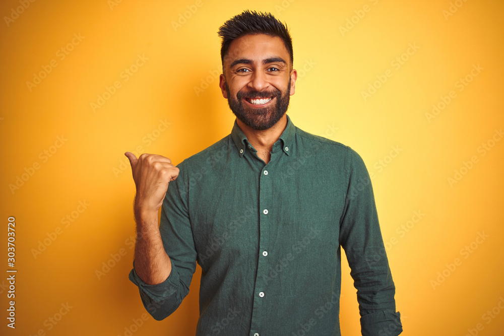 Wall mural young indian businessman wearing elegant shirt standing over isolated white background smiling with  - Wall murals