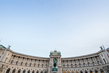 Hoffburg palace, on its Neue Burg aisle, taken from the Heldenplatz square, with the 19th century Prinz Eugen statue in front in Vienna, Austria. It is the former Austro Hungarian imperial palace