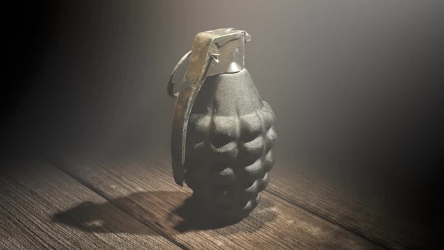 Endless 360 degrees animation of pineapple grenade in the dark background. 4KHD