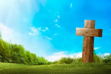 Christian cross on the green grass