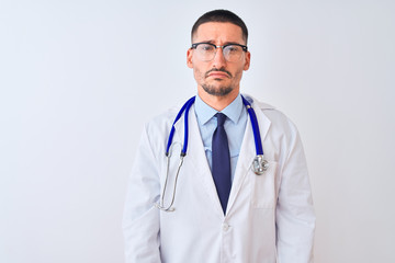 Young doctor man wearing stethoscope over isolated background depressed and worry for distress, crying angry and afraid. Sad expression.
