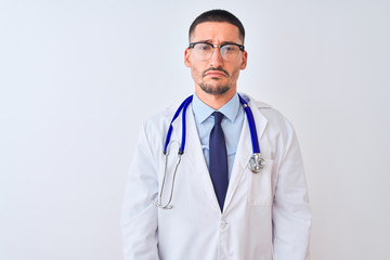Fototapeta premium Young doctor man wearing stethoscope over isolated background depressed and worry for distress, crying angry and afraid. Sad expression.