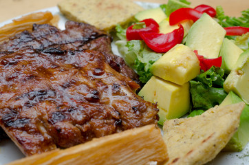 bbq rib, arepa and avocado salad