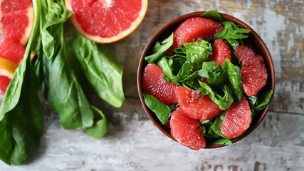Fresh juicy salad with spinach and grapefruit. Bright vegan salad. Grapefruit Salad. Refreshing...