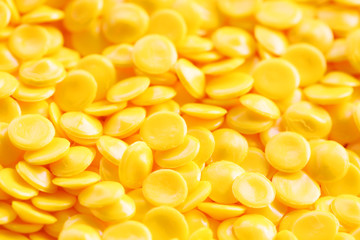 close up of yellow industrial plastic pellet background