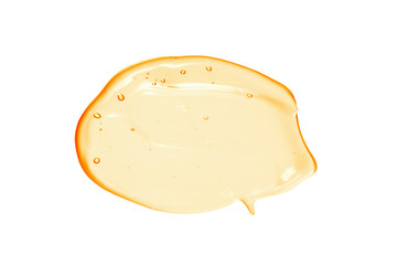 Serum gel sample. Orange colored cosmetic liquid cream swatch isolated on white background. Vitamin C skincare product