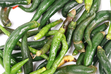 Bunch of green chili isolated white background