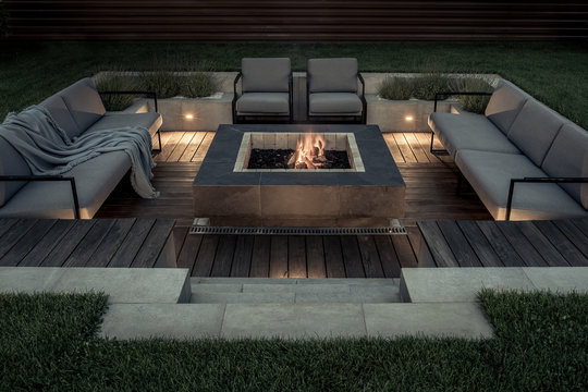 Outdoor zone for relax with burning fire pit